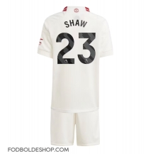 Manchester United Luke Shaw #23 Tredjetrøje Børn 2023-24 Kortærmet (+ Korte bukser)